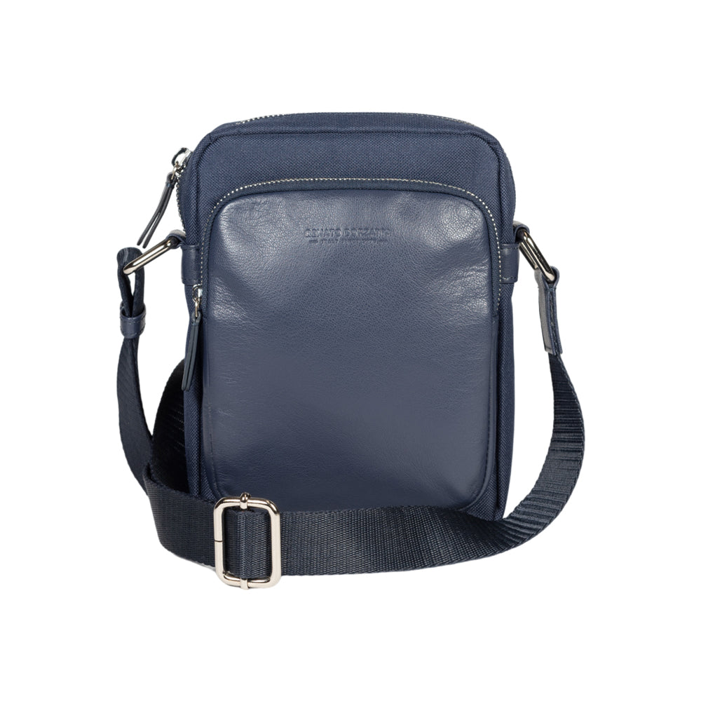 RB2002D | Nylon/Vera Leather Shoulder Bag, with light grain. Zipper closure and adjustable shoulder strap - Blue color - Size: 15.5 x 21 x 7 cm. Packaging: Non-Woven Fabric Bag