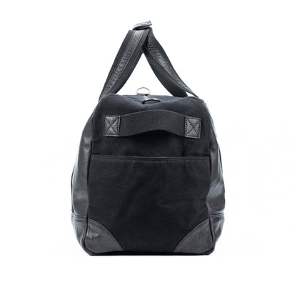 K0024AB | Canvas/Vera Leather Travel Duffle Bag, full-grain, ruffled - Black Color. Nickel Antique Accessories, Zipper Closure. Dimensions: 48 x 31 x 22 cm - Packaging: Tnt bag