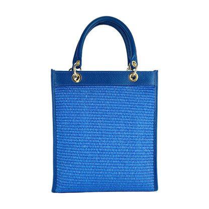 RB1026CH | Women's upright hand bag in Genuine Leather and Straw Made in Italy. Removable and adjustable leather shoulder strap. Shiny Gold hardware - Royal Blue color - Dimensions: 24 x 29 x 9 cm.
